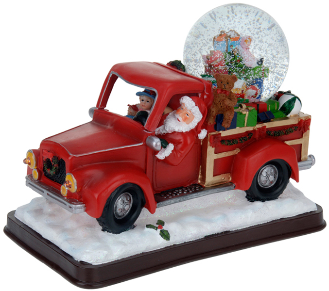 Kerstman met sneeuwbol in pickup truck Kerstman met sneeuwbol in pickup truck